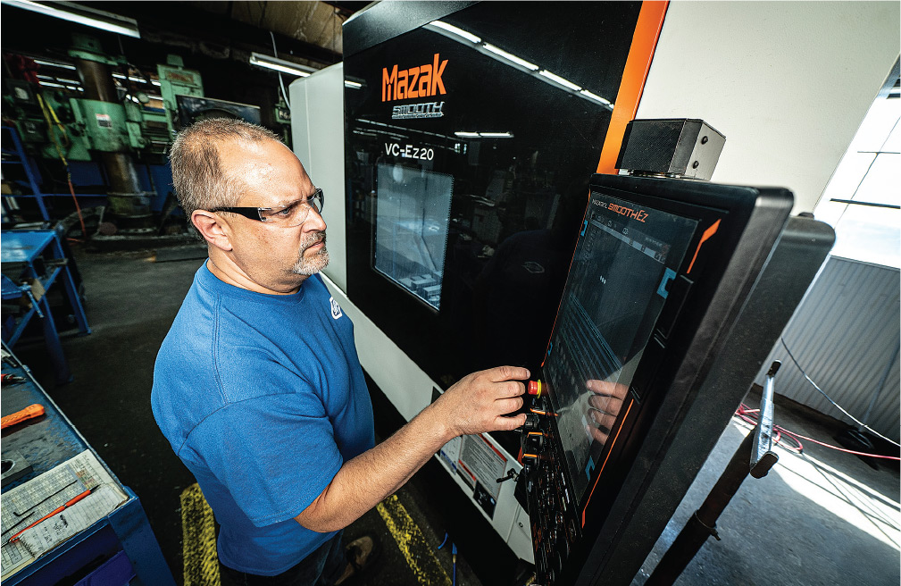 Chad Kanzelberger, CNC machinist for milling at Graetz Manufacturing, operates a VC-Ez 20 three-axis vertical machining center.